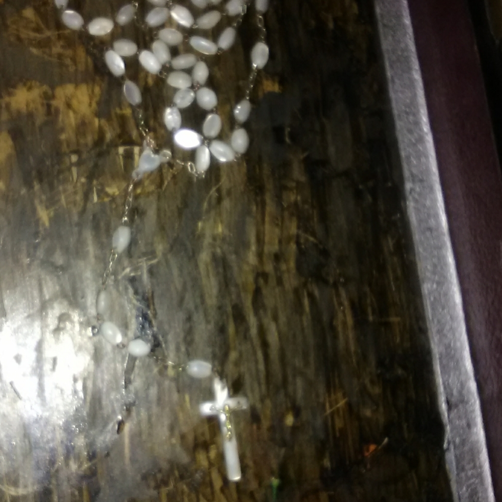 Rosary bead necklace made out of oyster shell